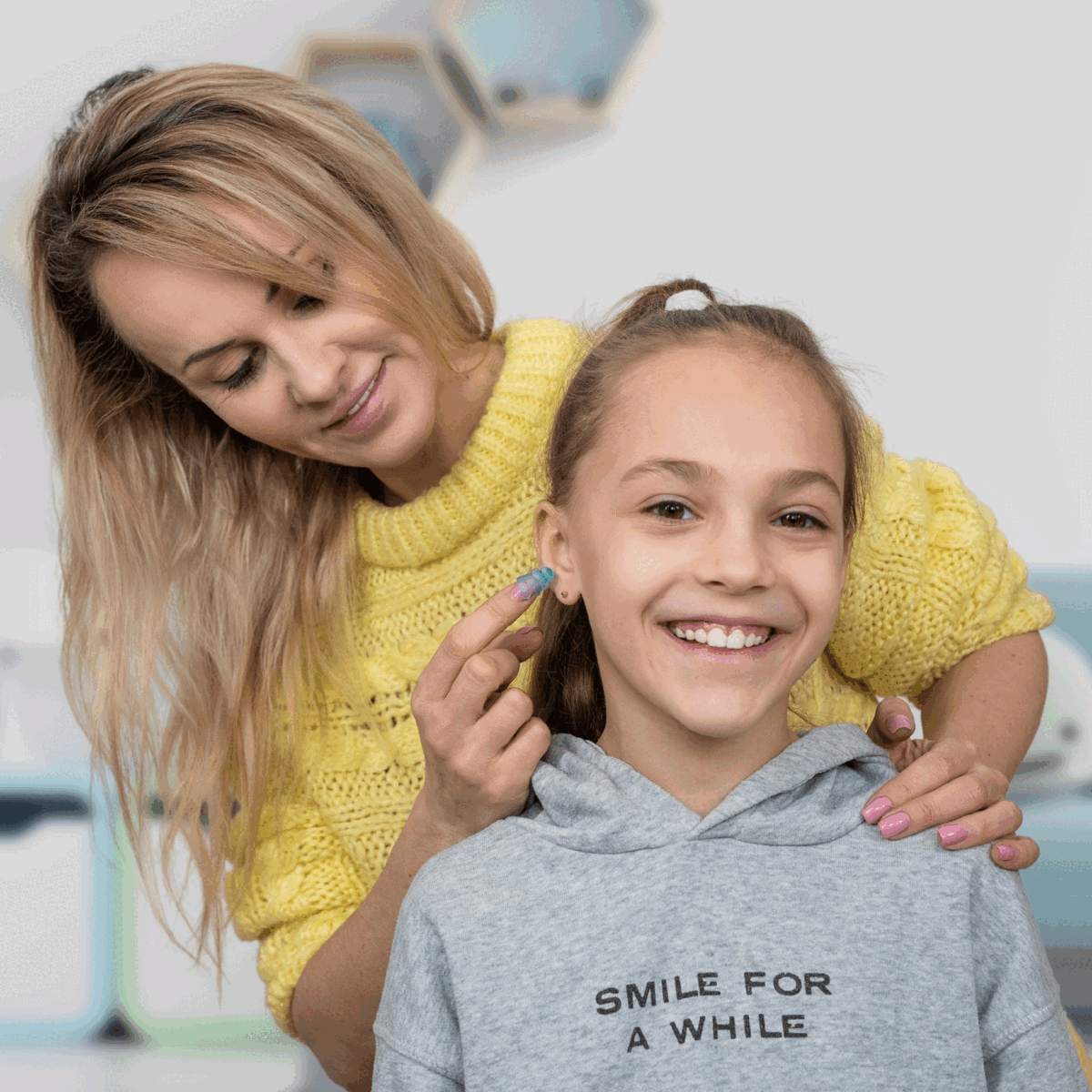 Mother-with-child-inserting-earplugs